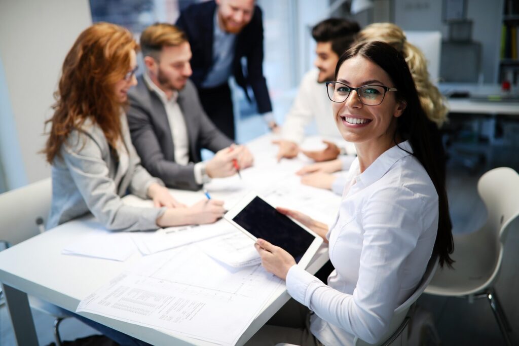 Successful company with happy employees in modern office